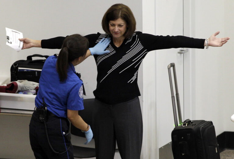A woman undergoes a pat-down during TSA security screening, Friday, Nov. 19, 2010, at Seattle-Tacoma International Airport in Seattle. (AP Photo/Ted S. Warren)