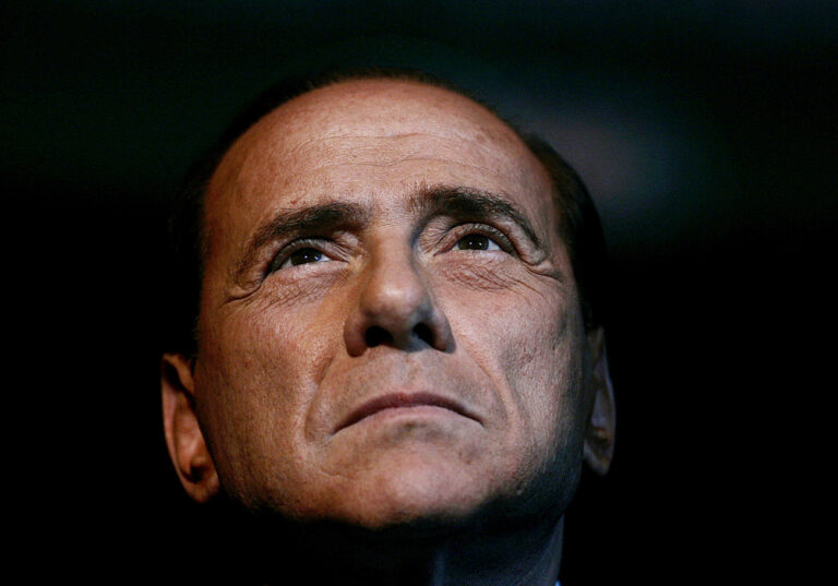 In this Friday, Feb. 3, 2006 photo, Italian Premier Silvio Berlusconi attends an Italian Republican party program conference in Rome. Pressure mounted on Premier Silvio Berlusconi to resign so a new government could pass the economic reforms Italy needs to avoid financial disaster, as the country's borrowing rates spiked Monday, Nov. 7, 2011, and talk of early elections intensified. (AP Photo/Gregorio Borgia)