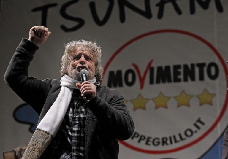 epa03596277 The leader of the 'Five Stars Movement', Italian comedian Beppe Grillo, addresses supporters during the closing day of Italian electoral campaign, on the Piazza San Giovanni in Rome, 22 february 2013. Political analysts say the Five Star Movement of comedian Beppe Grillo could win as much as 20 per cent of the vote and come in third at the polls. Grillo ended his so-called 'Ttsunami tour' in Rome with a street event that was expected to draw tens of thousands of people. Although he has been fronting the movement's campaign, he is not standing for parliament. EPA/MASSIMO PERCOSSI