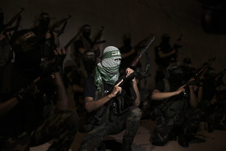 epa03851305 Palestinian militants, members of the Ezz Al-Din Al Qassam Brigades, the military wing of Hamas, participating in a march along the streets of the Gaza Strip, 04 September 2013. EPA/ALI ALI