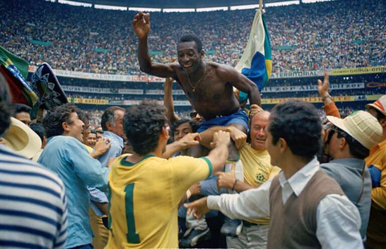 Brazil's Pele is hoisted on shoulders of his teammates after Brazil won the ninth World Cup final against Italy, 4-1, in Mexico City's Estadio Azteca, Mexico, on June 21, 1970. Pele, who scored the opening goal of the game and assisted two, wins his third winner's medal. The World Cup victory is Brazil's third win for the Jules Rimet Cup. (KEYSTONE/AP Photo)