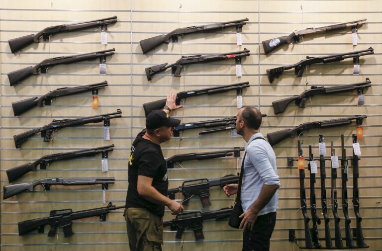 epa04945036 A visitor attends the 'Arms and Security - 2015' exhibition in Kiev, Ukraine, 23 September 2015. The XII International Trade Fair 'Arms and Security – 2015' is described as the most informative exhibition for security professionals, military professionals and sport weapon users and will take place from 22 to 25 September 2015 in Kiev. EPA/SERGEY DOLZHENKO