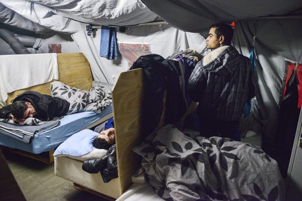 epa05126719 (FILE) A file photo dated 13 January 2016 showing refugees in their beds at the refugee tent camp in Thisted, northern Jutland, Denmark. The camp contains small appartment areas in the gym, bunkbeds and tents. Danish lawmakers were 26 January 2016 set to vote on measures to tighten asylum laws, including a controversial plan to seize assets from asylum seekers to pay for their stay, despite criticism from human rights groups. The bill was expected to pass as the right-leaning Liberals' minority government has secured backing from others, including the main opposition Social Democrats and the anti-immigrant Danish People's Party. The move would allow for asylum seekers' belongings to be searched and for cash or valuables exceeding 10,000 kroner (1,450 dollars) to be seized. The cash and proceeds from the sale of the valuables - such as watches and mobile phones - would be used to pay for the asylum seekers' stay in Denmark. EPA/SARA GANGSTED DENMARK OUT