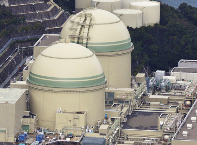 This Jan. 12, 2016 photo, shows No. 3 nuclear reactor, bottom, at Takahama nuclear power station in Takahama town in Fukui prefecture, northwestern Japan. Japan has restarted a nuclear reactor that burns plutonium-based fuel for power generation, first under the post-Fukushima safety rules. The No. 3 reactor at Takahama nuclear plant in western Japan, operated by Kansai Electric Power Co., becomes the first one using plutonium-uranium hybrid fuel known as MOX to go back online since the 2011 meltdowns at Fukushima. (Kyodo News via AP) JAPAN OUT, MANDATORY CREDIT