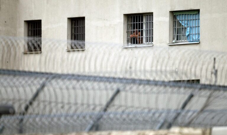 epa05583288 An inmate looks out through the bars of his window at the Justizvollzugsanstalt (JVA) Leipzig prison in Leipzig, Germany, 13 October 2016. Jaber al-Bakr, who was arrested on suspicion of terrorism, was found hanged in his cell in the Leipzig prison on 12 October 2016. Media reported on 12 October 2016 that Syrian terror suspect Jaber Al-Bakr has been found dead in his prison cell in Leipzig, Germany. The 22-year-old Syrian national had been on the run since an anti-terrorist raid in Chemnitz on 08 October and was captured by fellow Syrian refugees in Leipzig on 10 October who handed him over to the police. EPA/SEBASTIAN WILLNOW