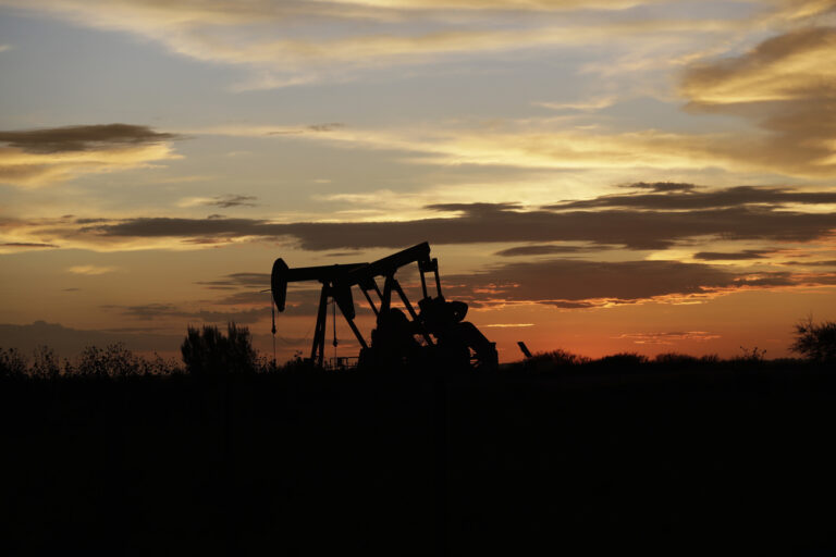 Pumpjacks work in an oil field at sunset after a thunderstorm passed through the area, Monday, June 5, 2017, in Karnes City, Texas. (AP Photo/Eric Gay)