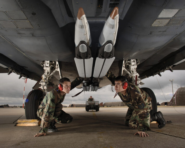 In this photo released by the U.S. Air Force on Wednesday Aug. 2, 2006, U.S. Air Force Airman 1st Class Matt Aggers, from Hannibal, Mo. left, and Staff Sgt. Randy Broome from Houston, Texas do a final check of the stowed twin wings on four ground-training GBU-39 small-diameter bombs loaded on an F-15E Strike Eagle at Royal Air Force (RAF) Lakenheath, England, on Tuesday, Aug. 1, 2006. When released, the bombs rotate and deploy diamond-backed wings. (AP Photo/U.S. Air Force, Lance Cheung)