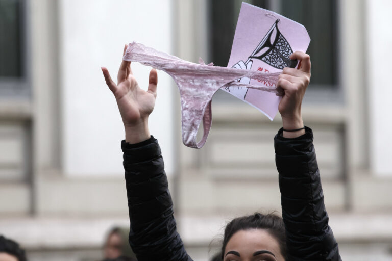 People demonstrate holding a knicker, during a demonstration against violence towards women on occasion of the International Day for the Elimination of Violence against Women, in Geneva, Switzerland, Saturday, November 24, 2018. (KEYSTONE/Salvatore Di Nolfi)