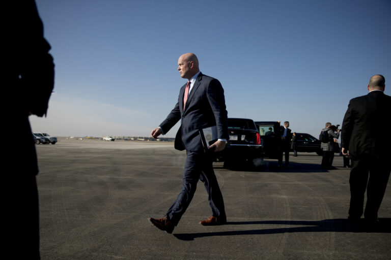 Acting United States Attorney General Matt Whitaker arrives with President Donald Trump at Kansas City International Airport in Kansas City, Mo., Friday, Dec. 7, 2018, for the 2018 Project Safe Neighborhoods National Conference. (AP Photo/Andrew Harnik)