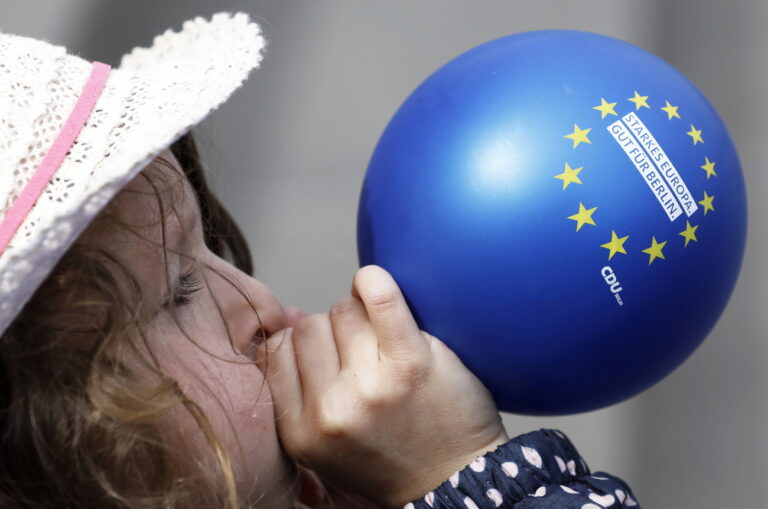 epa07548763 A child blows up a balloon during the monthly pro-European Union rally titled 'Pulse of Europe' in Gendarmenmarkt, Berlin, Germany, 05 May 2019. The citizens' initiative was founded to encourage EU citizens to promote a 'pan-European' identity. The next elections to the European Parliament will be held between 23 and 26 May 2019. EPA/FELIPE TRUEBA