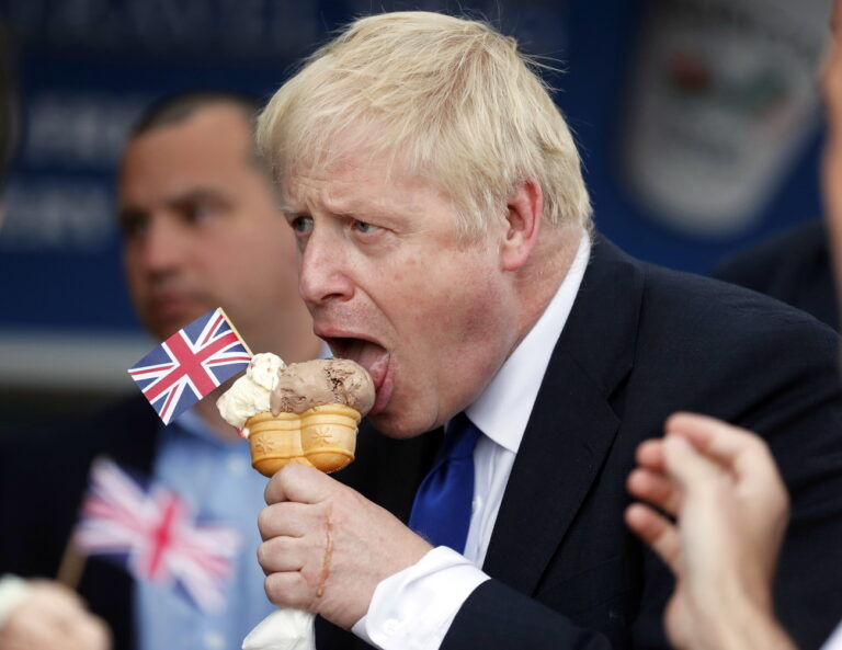 epa07699818 Conservative Party leadership candidate Boris Johnson eats an ice cream in Barry Island, Wales, Britain, 06 July 2019 ahead of the Conservative party leadership hustings in Cardiff. The two contenders, Jeremy Hunt and Boris Johnson are competing for votes from party members, with the winner replacing Prime Minister Theresa May as party leader and Prime Minister of Britain's ruling Conservative Party. EPA/FRANK AUGSTEIN / POOL