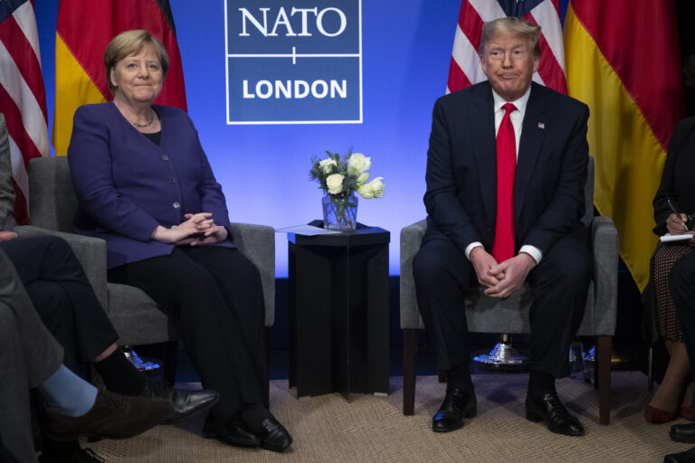 President Donald Trump meets with German Chancellor Angela Merkel during the NATO summit at The Grove, Wednesday, Dec. 4, 2019, in Watford, England. (AP Photo/ Evan Vucci)