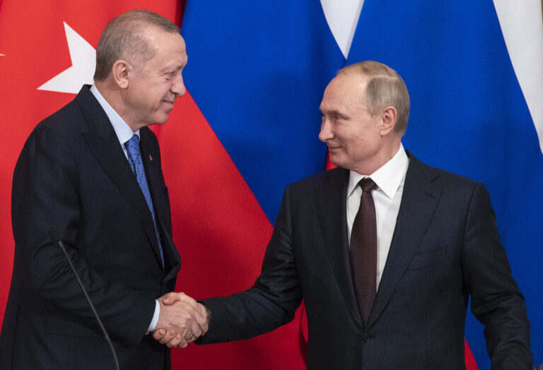 Russian President Vladimir Putin, right, and Turkish President Recep Tayyip Erdogan shake hands during a news conference after their talks in the Kremlin, in Moscow, Russia, Thursday, March 5, 2020. Russian President Vladimir Putin and his Turkish counterpart, Recep Tayyip Erdogan, say they have reached agreements that could end fighting in northwestern Syria. (AP Photo/Pavel Golovkin, Pool)