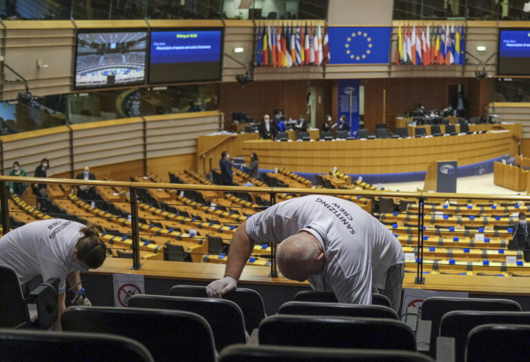epa08419627 Sanitizing crews clean the hemicycle ahead to plenary session of European Parliament in Brussels, Belgium, 13 May 2020. Due to the coronavirus disease COVID-19, plenary session is reduced to an one day debate and a second day voting and is mainly video conferenced. EPA/OLIVIER HOSLET