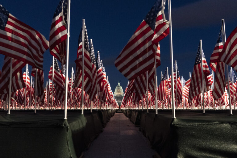 Flags are placed on the National Mall, with the U.S. Capitol behind them, ahead of the inauguration of President-elect Joe Biden and Vice President-elect Kamala Harris, Monday, Jan. 18, 2021, in Washington. (AP Photo/Alex Brandon)
