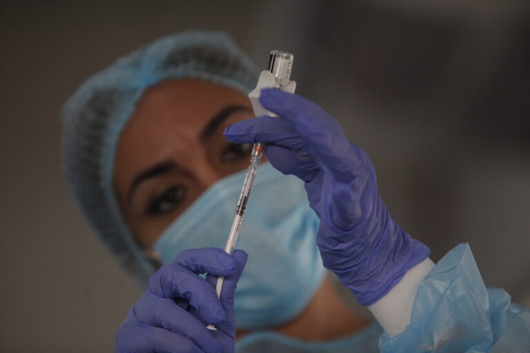 epa09035850 Health personnel prepare a vaccine against Covid-19 during the closing of the first phase of vaccination, in Panama City, Panama, 25 February 2021. Panama has allocated 56 million dollars for the purchase of 5.5 million vaccines: 3 million from Pfizer, 1,092,000 from AstraZeneca, 300,000 from Johnson and Johnson, and 1,112,410 from the Covax Mechanism, according to official information, and has initiated contacts with Russia to access the Sputnik V vaccine. EPA/Carlos Lemos