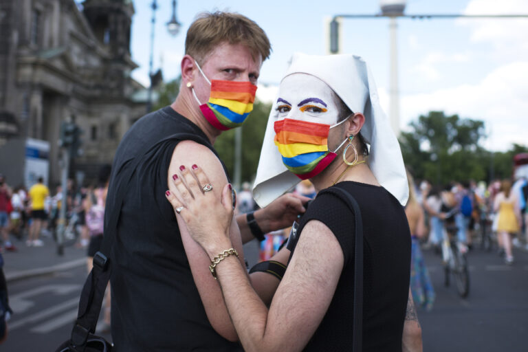 Demonstrators attend a pride rally, in Berlin, Germany, Saturday, June 26, 2021. People set off on three routes toward the central Alexanderplatz in a format meant both to avoid bigger gatherings during the pandemic and to reflect the diversity of the LGBT community. (AP Photo/Markus Schreiber)