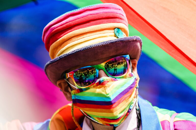 epa09362409 A participant dressed in rainbow colors poses for photographers during the 'CSD Berlin 2021' Christopher Street Day parade in Berlin, Germany, 24 July 2021. Due to the Coronavirus pandemic that causes the Covid-19 disease, this year's CSD demonstration only consists of five trucks and an expected crowd of some 20,000 participants. CSD is an annual European LGBTIQA* (lesbian, gay, bisexual, transgender, intersex, queer/questioning, asexual) celebration held in various cities across Europe for the rights of LGBTIQA* people. EPA/CLEMENS BILAN