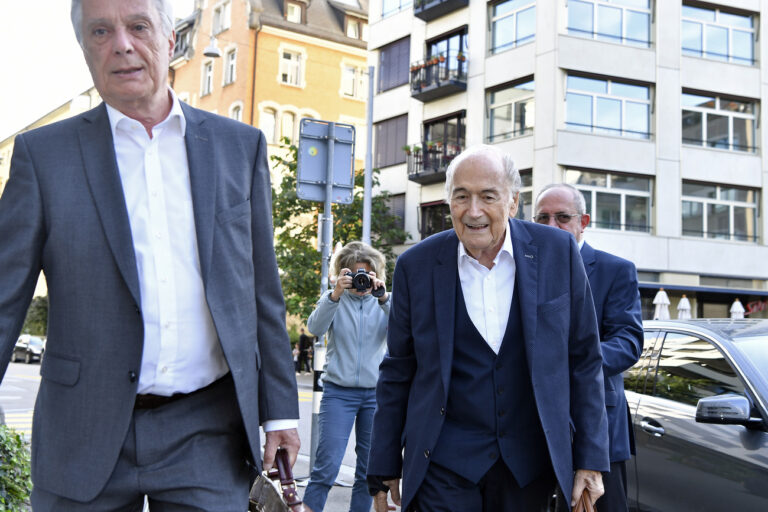 Former FIFA President Joseph S. Blatter, right, with his lawyer Lorenz Erni, left, on the way to the Federal Prosecutor's Office in Zurich, Switzerland, on Monday, August 9, 2021. .Sepp Blatter, the former world football chief, faces his final hearing with a Swiss prosecutor on Monday in a fraud probe surrounding a 2011 FIFA payment to Michel Platini. (KEYSTONE/Walter Bieri)