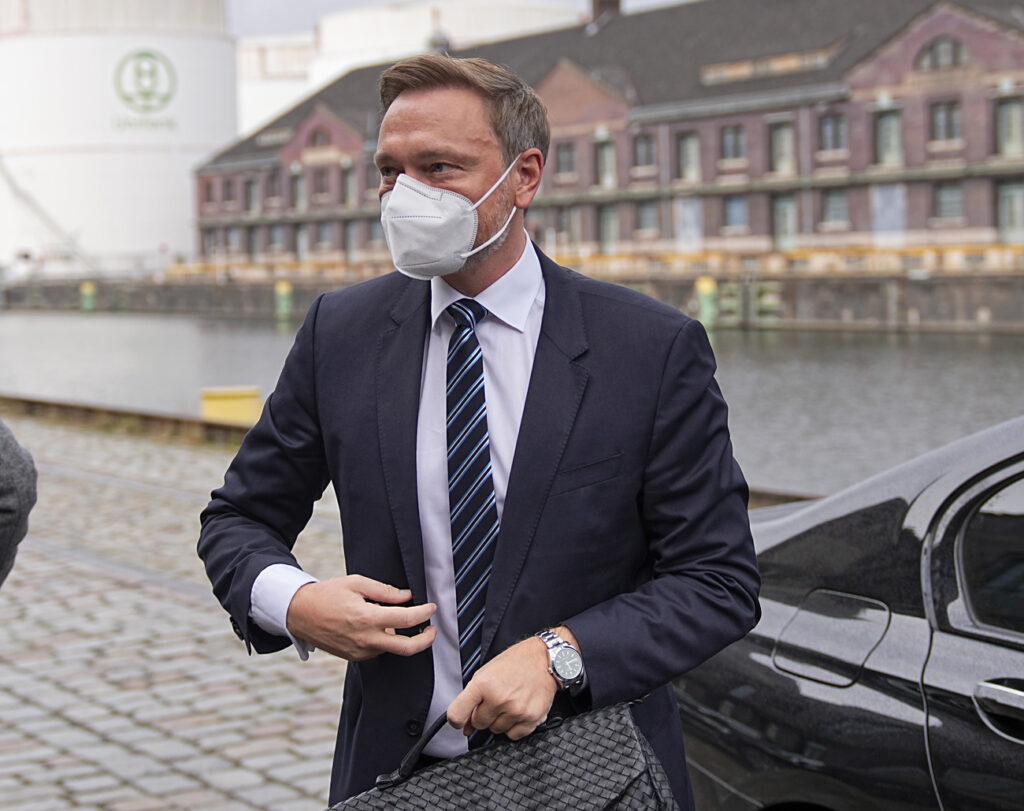 Christian Lindner, party leader of the FDP, arrives for the presentation of the coalition agreement, in Berlin, Wednesday, Nov. 24, 2021. The three parties negotiating to form Germany's next government will finalize and present their coalition agreement Wednesday, two of the prospective partners said. The deal paves the way for center-left leader Olaf Scholz to replace longtime Chancellor Angela Merkel in the coming weeks. (Kay Nietfeld/dpa via AP)