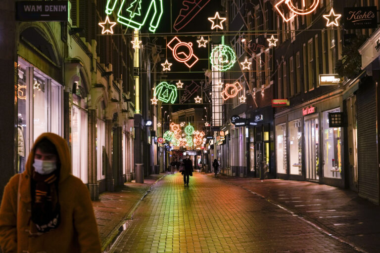 The capital's shopping streets are near-empty after 5 pm in Amsterdam, Netherlands, Monday, Nov. 29, 2021, after a tougher COVID-19 related lockdown came into effect starting Sunday, moving closing time forward of three hours from 8 pm amid swiftly rising infections and ICU admissions. (AP Photo/Peter Dejong)