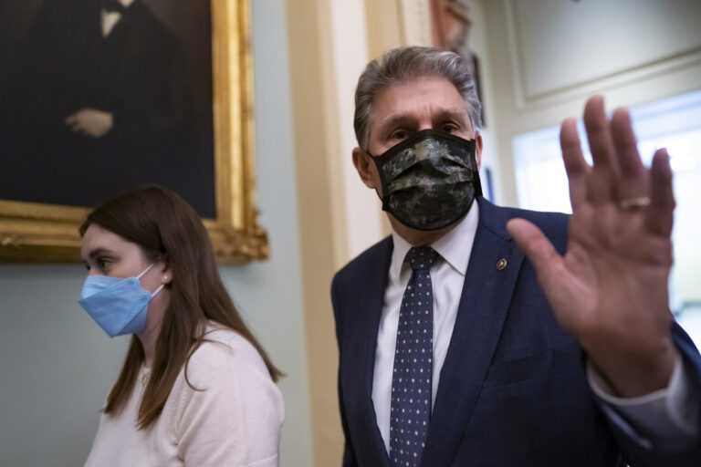 Sen. Joe Manchin, D-W.Va., walks past reporters after attending a lengthy Democratic Caucus meeting as the Senate continues to grapple with end-of-year tasks at the Capitol in Washington, Thursday, Dec. 16, 2021. ManchinâÄ™s reluctance to endorse the Biden administrationâÄ™s expanded child tax credit program is rippling through his home state of West Virginia. Manchin, a moderate Democrat, is one of the last holdouts delaying passage of President Joe BidenâÄ™s massive social and environmental package. (AP Photo/J. Scott Applewhite)