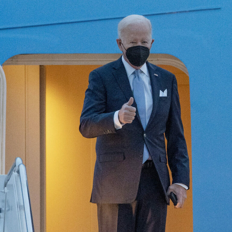 President Joe Biden gestures as he board Air Force One en route to South Carolina State University's 2021 Fall Commencement Ceremony, Friday, Dec. 17, 2021, at Andrews Air Force Base, Md. (AP Photo/Gemunu Amarasinghe)