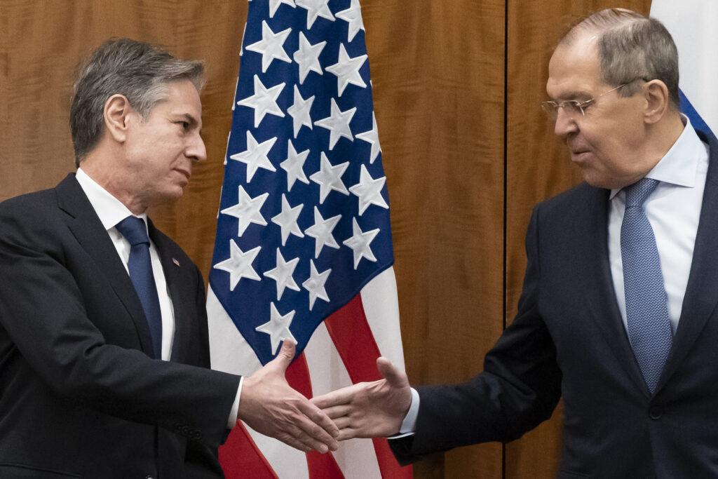 Secretary of State Antony Blinken greets Russian Foreign Minister Sergey Lavrov before their meeting, Friday, Jan. 21, 2022, in Geneva, Switzerland. (AP Photo/Alex Brandon, Pool)
