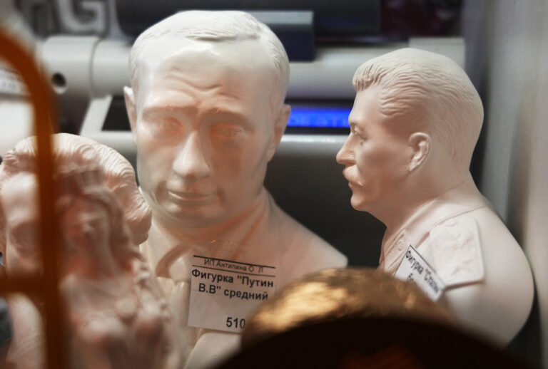 Statuettes of Soviet dictator Josef Stalin, right, and Russian President Vladimir Putin are displayed for sale in a souvenir shop in St. Petersburg, Russia, Monday, Jan. 24, 2022. (AP Photo/Dmitri Lovetsky)