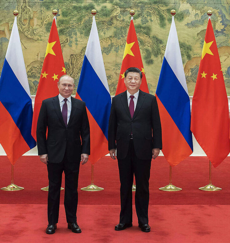 In this photo provided by China's Xinhua News Agency, Chinese President Xi Jinping, right, holds talks with Russian President Vladimir Putin at the Diaoyutai State Guesthouse in Beijing, China, Friday, Feb. 4, 2022. (Li Tao/Xinhua via AP)
