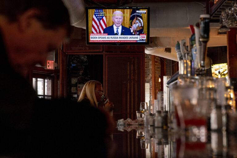 President Joe Biden speaks about Russia's invasion of Ukraine on a television at Shaws Tavern in Washington, Thursday, Feb. 24, 2022. (AP Photo/Andrew Harnik)