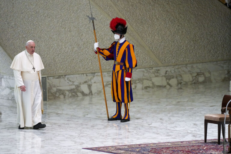 Pope Francis arrives for his weekly general audience in the Paul VI Hall at The Vatican, Wednesday, March 16, 2022. (AP Photo/ Gregorio Borgia)