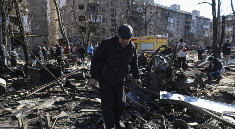 epa09833923 A man search for his belongings in what was his garage destroyed by shelling in Kyiv as Russia's attack on Ukraine continues, Kyiv, Ukraine, 18 March 2022. On 24 February Russian troops had entered Ukrainian territory in what the Russian president declared a 'special military operation', resulting in fighting and destruction in the country, a huge flow of refugees, and multiple sanctions against Russia. EPA/MIGUEL A. LOPES