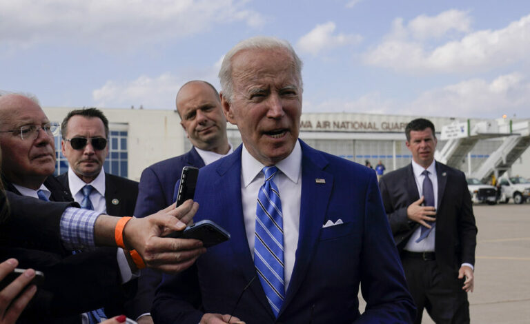 President Joe Biden speaks to reporters before boarding Air Force One at Des Moines International Airport, in Des Moines Iowa, Tuesday, April 12, 2022, en route to Washington. Biden said that Russia's war in Ukraine amounted to a 