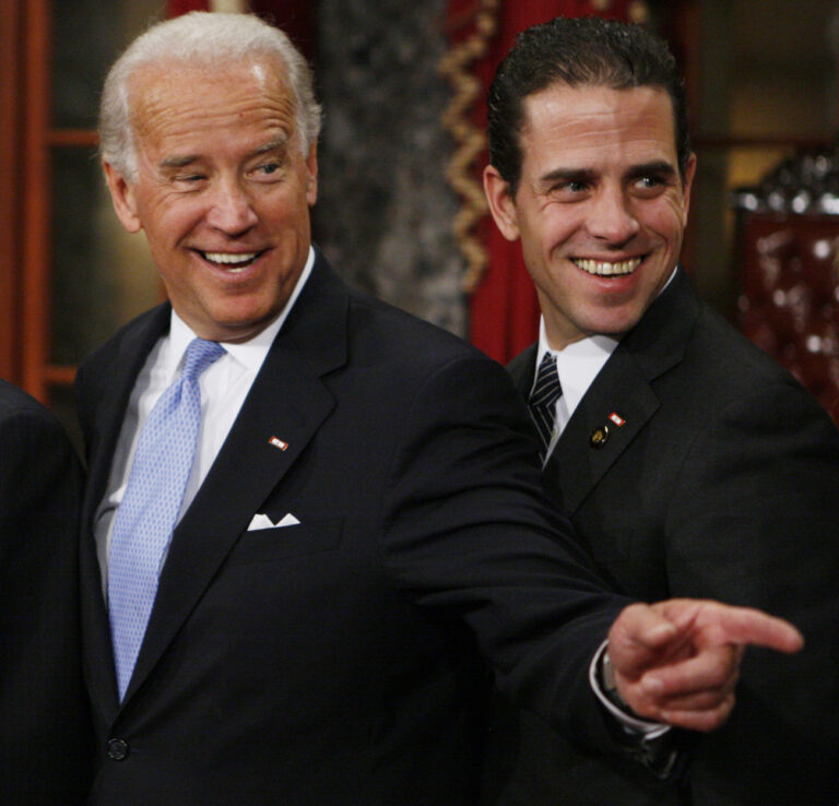 FILE - Then Vice President-elect, Sen. Joe Biden, D-Del., left, stands with his son Hunter during a re-enactment of the Senate oath ceremony in the Old Senate Chamber on Capitol Hill in Washington on Jan. 6, 2009. Hunter Biden, an ongoing target for conservatives, has a memoir coming out April 6. The book is called âÄœBeautiful ThingsâÄ and will center on the younger Biden's well publicized struggles with substance abuse, according to his publisher. (AP Photo/Charles Dharapak, File)