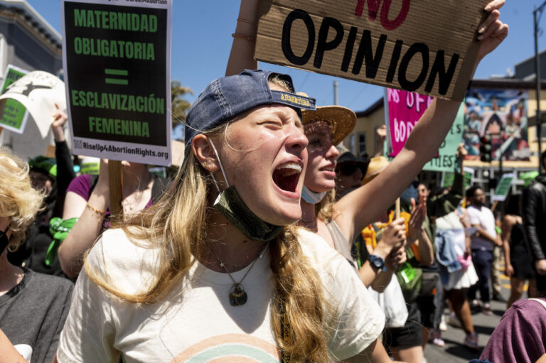 An abortion-rights protester, who declined to give her name, chants while marching through San Francisco's Mission District on Saturday, May 14, 2022. (AP Photo/Noah Berger)