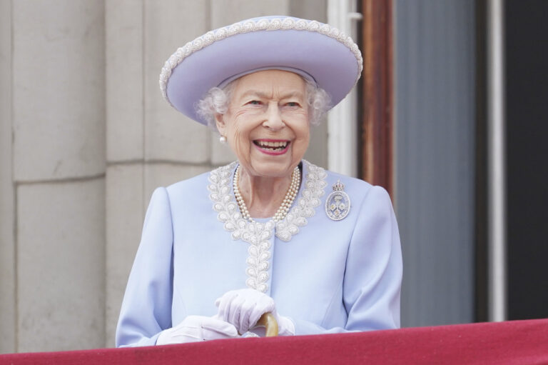 Queen Elizabeth II watches from the balcony during the Trooping the Color ceremony at Horse Guards Parade in London, Thursday, June 2, 2022, on the first of four days of celebrations to mark the Platinum Jubilee. The events over a long holiday weekend in the U.K. are meant to celebrate the monarchâÄ™s 70 years of service. (Jonathan Brady/Pool Photo via AP)