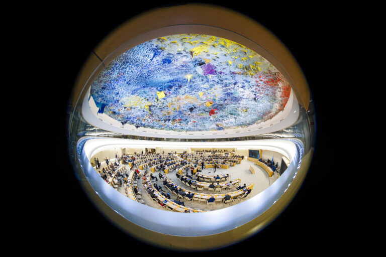 A general view taken with a fisheye lens shows delegates attending the opening day of the 50th session of the Human Rights Council, at the European headquarters of the United Nations in Geneva, Switzerland, Monday, June 13, 2022. (KEYSTONE/Valentin Flauraud)
