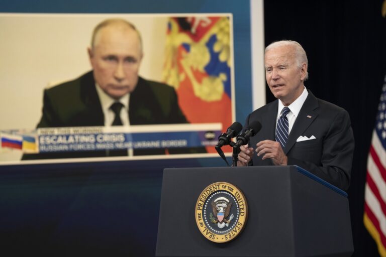 epa10028343 An image of Russian President Vladimir Putin (L) is shown as US President Joe Biden makes remarks on gas prices in the South Court Auditorium of the White House Complex in Washington, DC, USA, 22 June 2022. EPA/Chris Kleponis / POOL