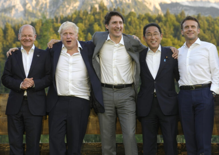 From left, German Chancellor Olaf Scholz, British Prime Minister Boris Johnson, Canada's Prime Minister Justin Trudeau, Japan's Prime Minister Fumio Kishida and French President Emmanuel Macron pose during a group photo at the G7 summit at Castle Elmau in Kruen, near Garmisch-Partenkirchen, Germany, on Sunday, June 26, 2022. The Group of Seven leading economic powers are meeting in Germany for their annual gathering Sunday through Tuesday. (AP Photo/Markus Schreiber, Pool)