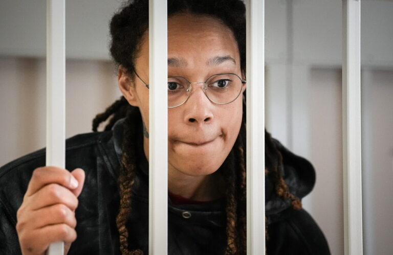 epa10091960 WNBA star and two-time Olympic gold medalist Brittney Griner stands in a cage at a court room prior to a hearing in Khimki City Court outside Moscow, Russia, 26 July 2022. Griner, a World Champion player of the WNBA's Phoenix Mercury team was arrested in February at Moscow's Sheremetyevo Airport after some hash oil was detected and found in her luggage, for which she now could face a prison sentence of up to ten years. EPA/ALEXANDER ZEMLIANICHENKO / POOL