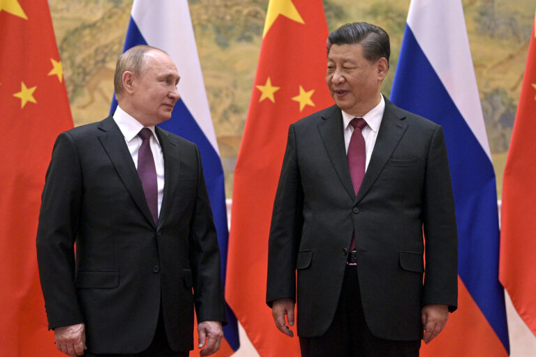 FILE - Chinese President Xi Jinping, right, and Russian President Vladimir Putin talk to each other during their meeting in Beijing, Feb. 4, 2022. Latvia and Estonia say they have left a Chinese-backed forum aimed at boosting relations with Eastern European countries, in what appears to be a new setback for China's increasingly assertive diplomacy. The move follows ChinaâÄ™s boosting of its relations with Russia, whose invasion of Ukraine is seen as a possible first step in a series of moves against countries that were once part of the Soviet Union. (Alexei Druzhinin, Sputnik, Kremlin Pool Photo via AP, File)