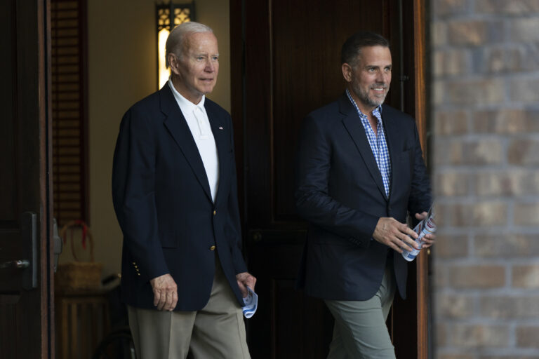 President Joe Biden and his son Hunter Bidden leave Holy Spirit Catholic Church in Johns Island, S.C., after attending a Mass, Saturday, Aug. 13, 2022. Biden is in Kiawah Island with his family on vacation. (AP Photo/Manuel Balce Ceneta)