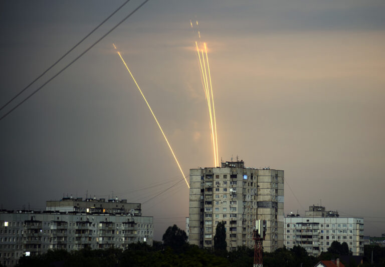 Russian rockets launch against Ukraine from Russia's Belgorod region are seen at dawn in Kharkiv, Ukraine, Monday, Aug. 15, 2022. (AP Photo/Vadim Belikov)