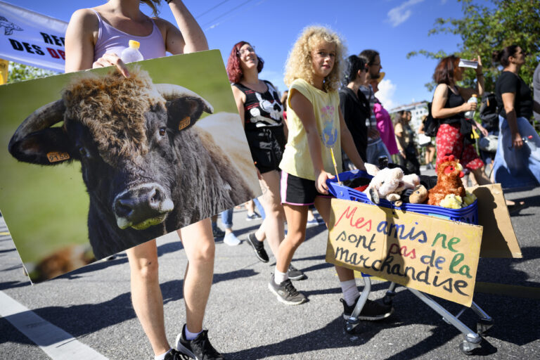 Anti-speciesism activists hold banners and posters, during a march for the 8th World Day for the End of Speciesism (WoDES), in Lausanne, Switzerland, Saturday, August 27, 2022. The World Day for the End of Speciesism invites animal defence societies all over the world to organize events that challenge speciesism and ask for a genuine consideration of animals interests.(KEYSTONE/Laurent Gillieron)