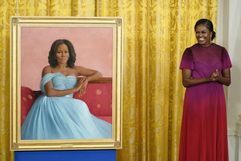 Former first lady Michelle Obama stands next to her official White House portrait during a ceremony in the East Room of the White House, Wednesday, Sept. 7, 2022, in Washington. The former first lady chose artist Sharon Sprung to do her portrait.Â (AP Photo/Andrew Harnik)
