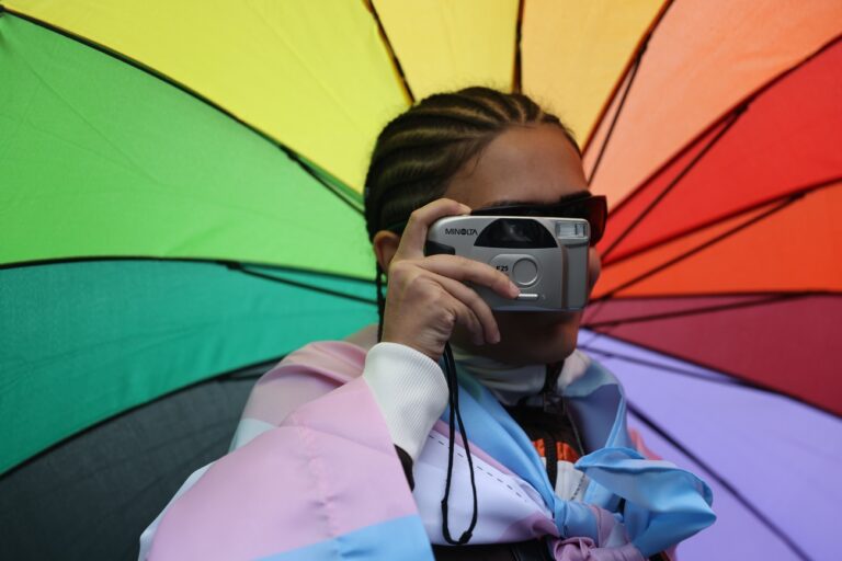 epa10190263 A participant takes a photo during the EuroPride march in Belgrade, Serbia, 17 September 2022. EuroPride, a pan-European international event dedicated to LGBTQ pride, is hosted by a different European city each year. Serbian government made a last minute announcement to allow the event after a decision to ban the march citing threats from right-wing extremist groups and fears of clashes. EPA/ANDREJ CUKIC