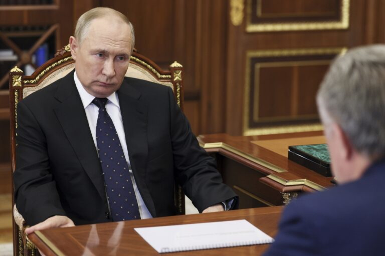 Russian President Vladimir Putin listens to Vitaly Mutko, the chief executive officer of Dom.RF, a state-owned company involved in the mortgage and realty market during their meeting at the Kremlin in Moscow, Russia. v in Moscow, Russia, Thursday, Sept. 22, 2022. (Gavriil Grigorov, Sputnik, Kremlin Pool Photo via AP)