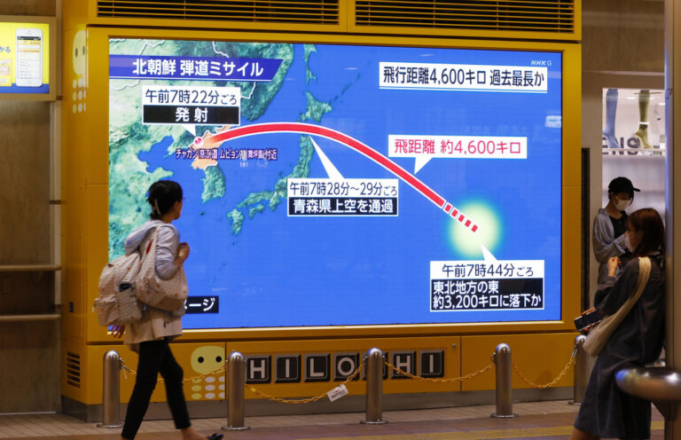 A huge monitor shows a North Korean ballistic missile flied over Japan, in Sapporo, Hokkaido, northern Japan on Oct. 4, 2022. (KEYSTONE/Kyodo News via AP)