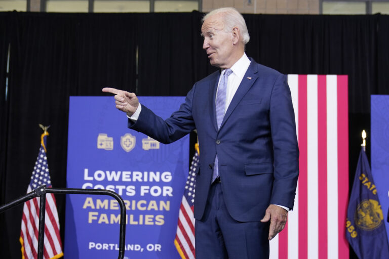 President Joe Biden acknowledges the audience as he arrive to speaks about lowering costs for American families at the East Portland Community Center in Portland, Ore., Saturday, Oct. 15, 2022. (AP Photo/Carolyn Kaster)